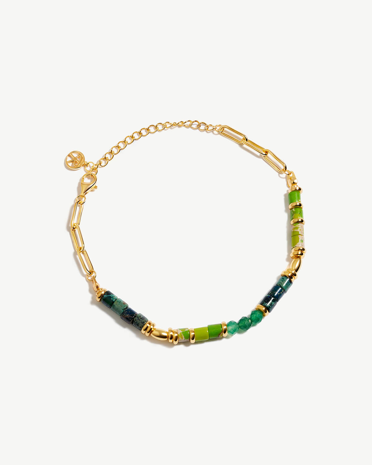 a gold chain bracelet with green and yellow beads